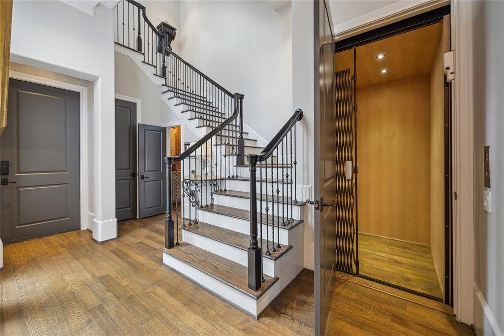Located next to the elegant staircase, an elevator provides convenient access to all three floors.
