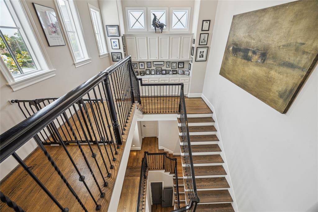 On your way to the third floor, you'll be greeted by gorgeous cabinetry and fantastic windows that fill the space with natural light.