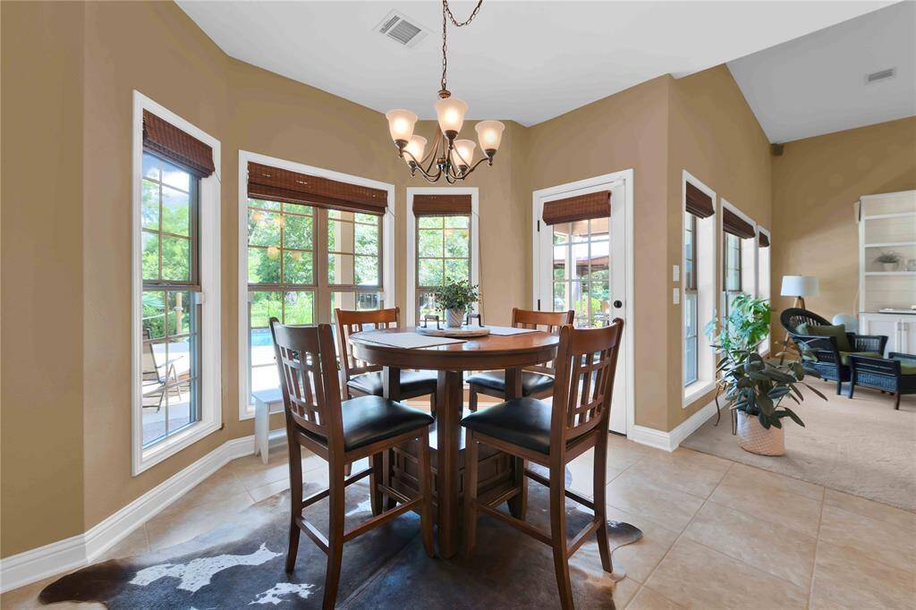 Breakfast nook with an absolutely stunning view of the back yard oasis