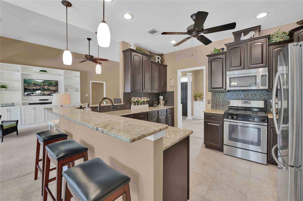 Kitchen opens to family room, great for entertaining.  Gorgeous granite counter tops and soft close cabinets/drawers
