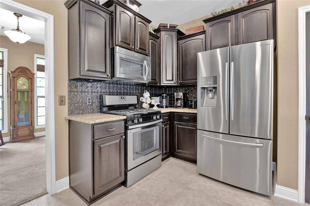 Kitchen has beautiful backsplash