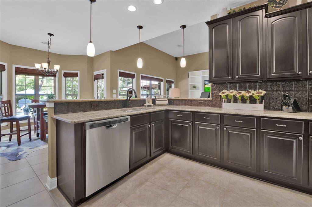 See how the kitchen opens up to the breakfast nook and the family room.  An entertainers dream!
