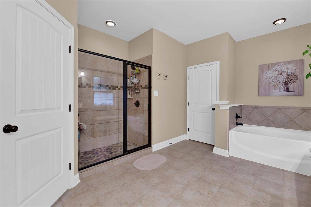 Relax in your soaking tub or enjoy the large stand alone shower