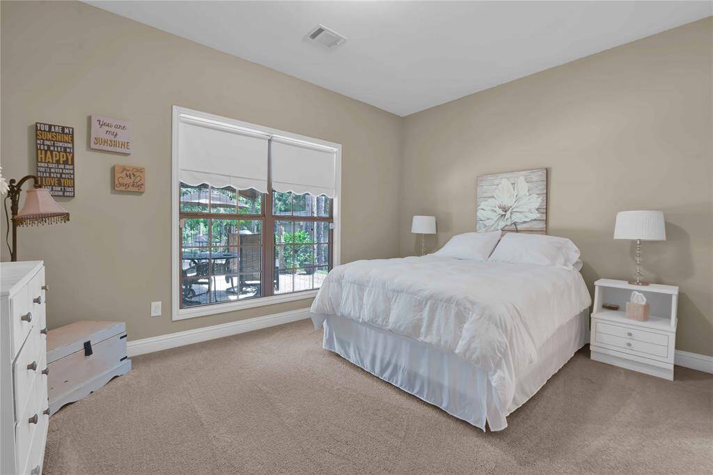 2nd Bedroom with a view of the backyard oasis