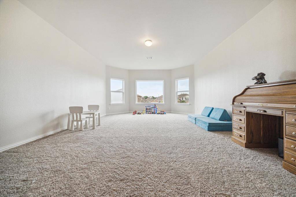 This incredible game room waits for you at the top of the stairs, providing an incredible common area & separation between the guest bedroom and secondary bedrooms.