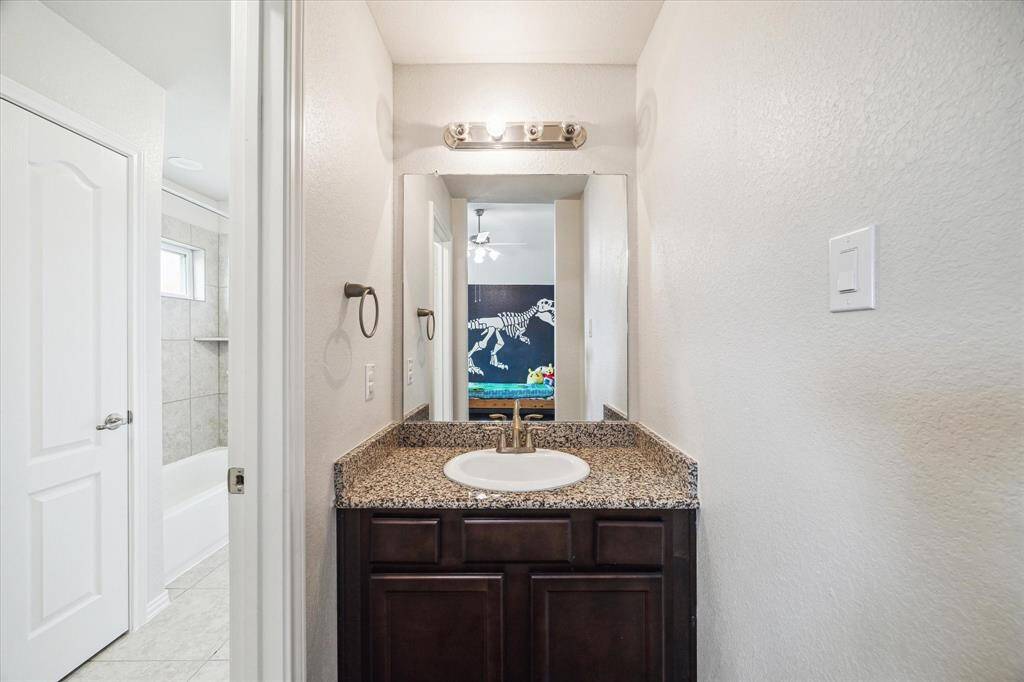 The private sink for bedroom 3 connecting to the Jack & Jill bathroom.