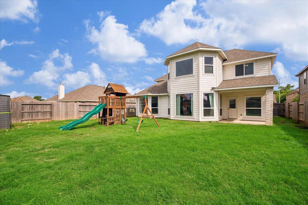 This expansive backyard easily accommodates a playset with plenty of room left over!