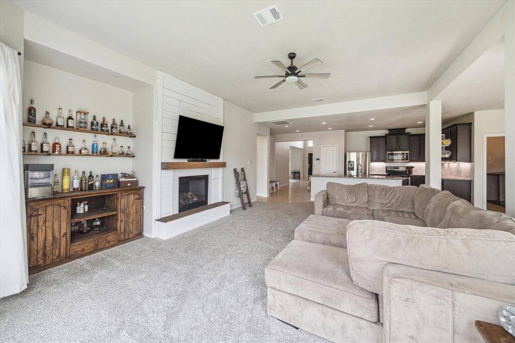 Your new living room features a custom built shiplap surround for the gas log fireplace, as well as additional shelving. Upgrades that are often overlooked but important include ceiling fans in all the bedrooms & living room, as well as 2" blinds & window coverings!