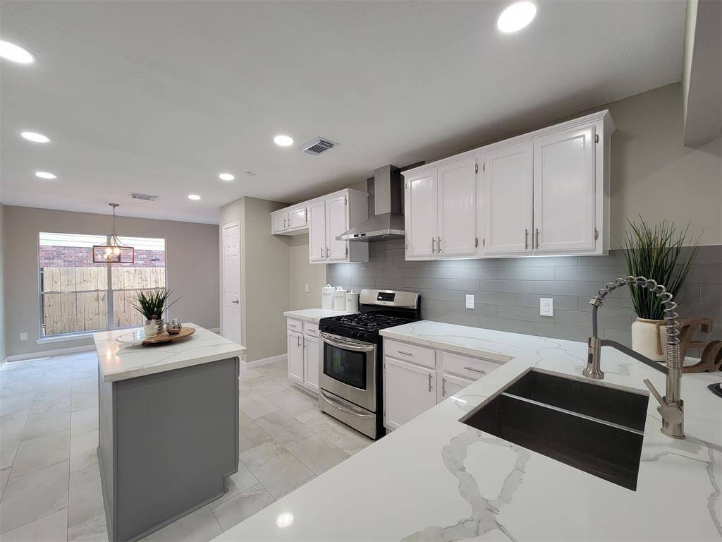 The island kitchen is perfect for entertaining or meal prepping.