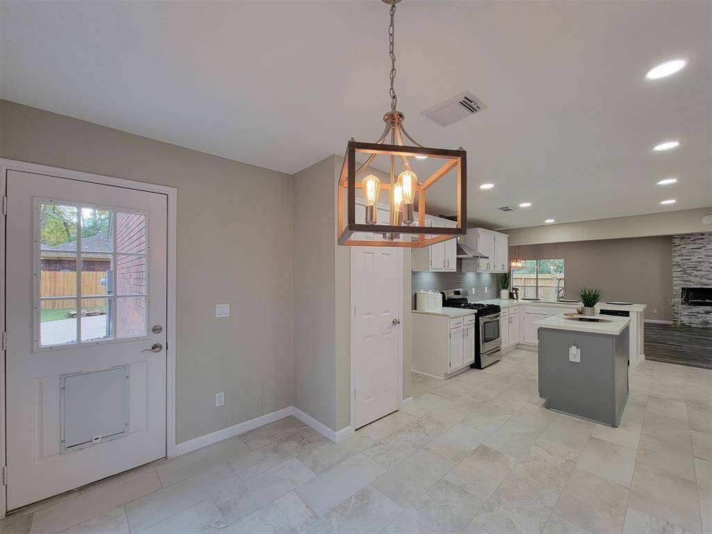Breakfast area just off of the kitchen with stylish light fixture.