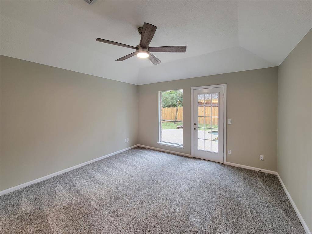 The Primary suite has nice carpet and private backyard access.
