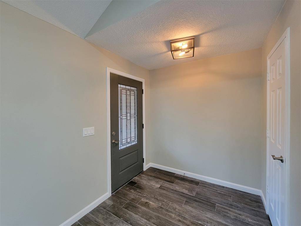 Front entryway with door to coat closet.