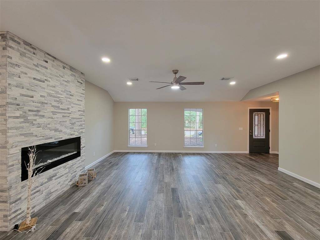 Chic fireplace and accent wall in the den.