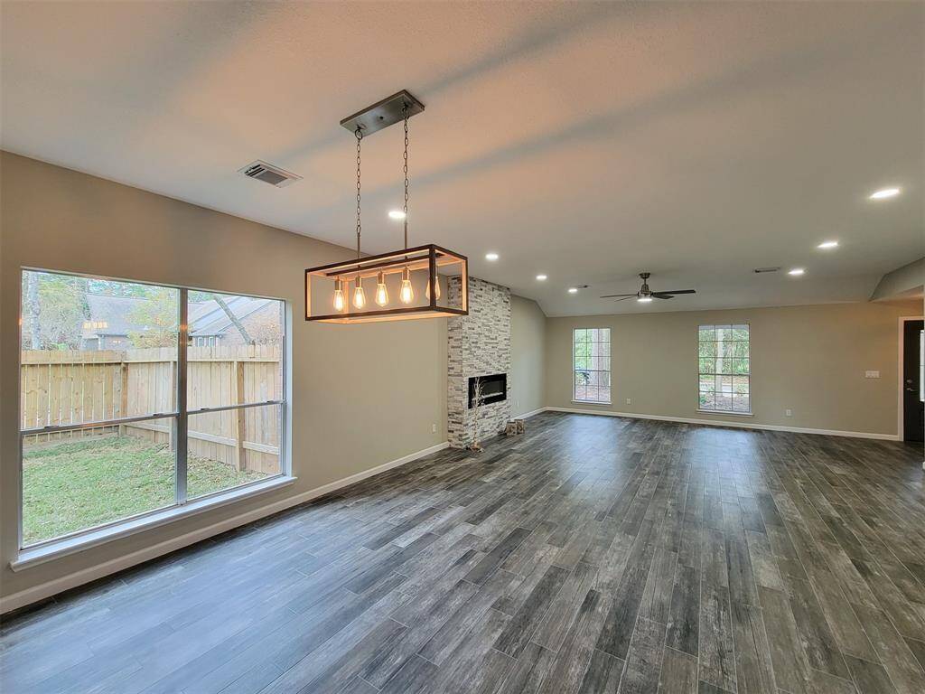 Formal dining and den flow together.