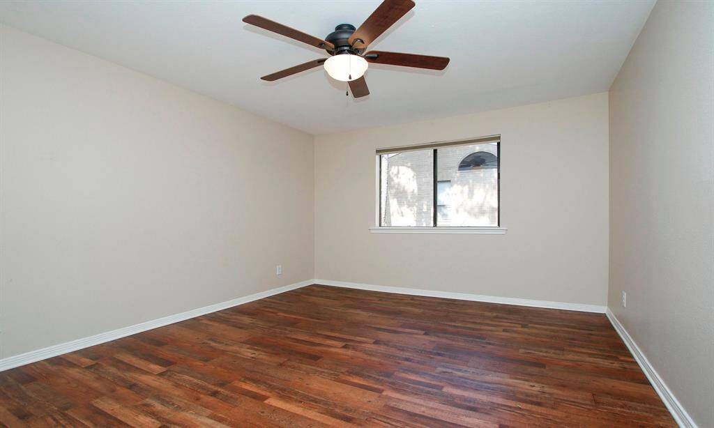 The spacious Bedroom offers a ceiling fan and LVP flooring.