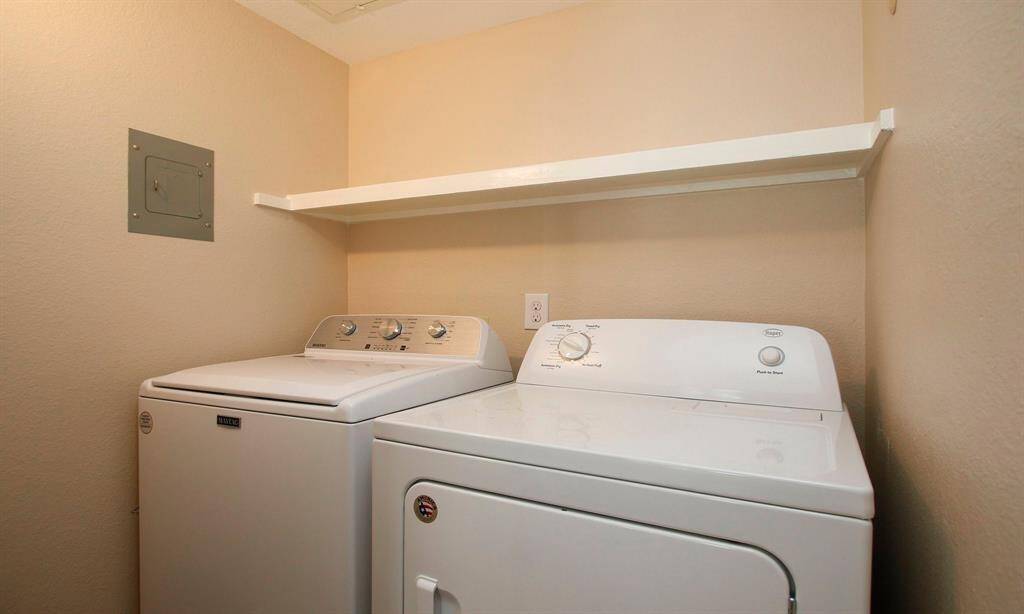 Just across from the Bedroom is a convenient Laundry closet featuring full size machines; Both the washer and dryer stay with the unit! Washer replaced in 2024.
