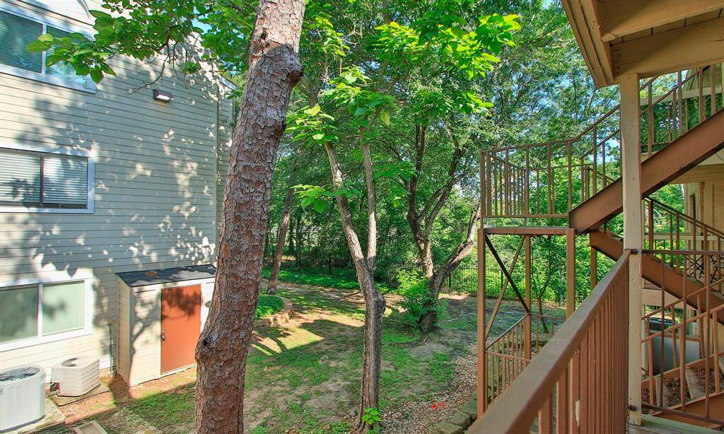 Private and quiet green space behind and to the right of the unit.