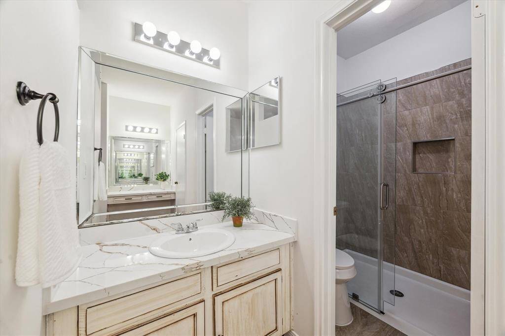 Modern, glass-enclosed shower.