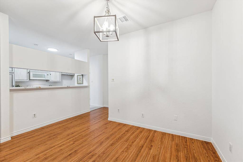 Bright dining area opens to a kitchen, creating an open and inviting space.