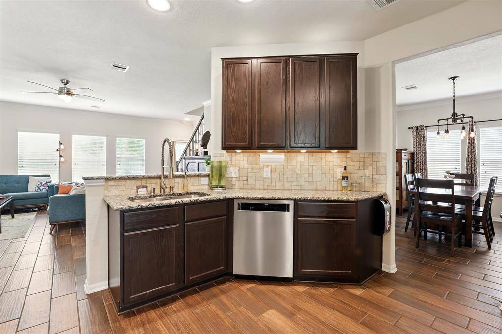 Kitchen with luxury finishes open to the living room