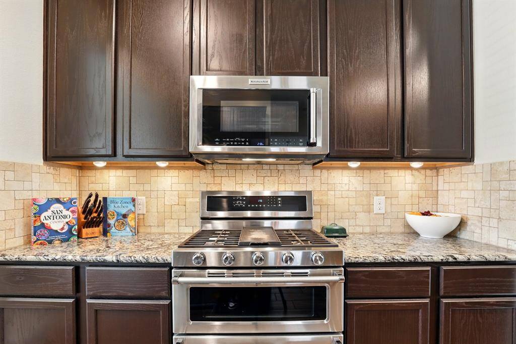 Illuminate your kitchen with elegant under-cabinet lighting and enjoy premium appliances.