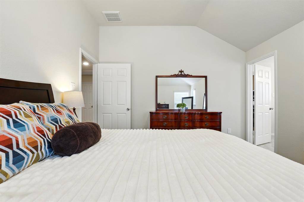 Bright and inviting, the primary bedroom does not disappoint!