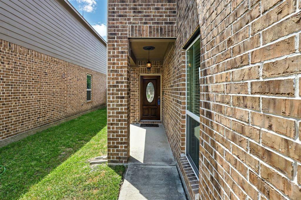 Inviting covered entrance ensures privacy and comfort.