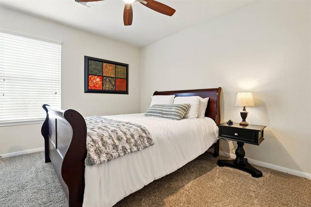 Expansive and inviting secondary bedroom.