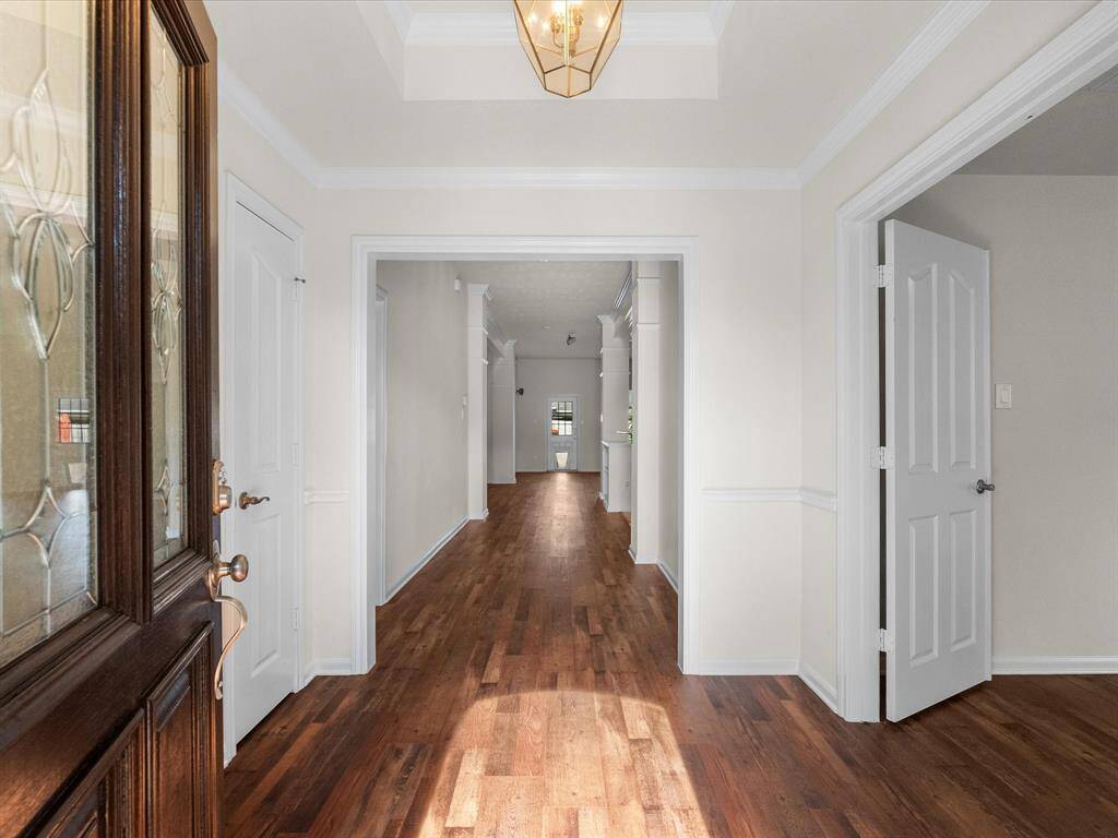 The grand foyer offers a beautiful spacious entrance to receive your guests.  Coat closet to the left, private secondary primary suite to the right, complete with en suite full bath. Welcome!