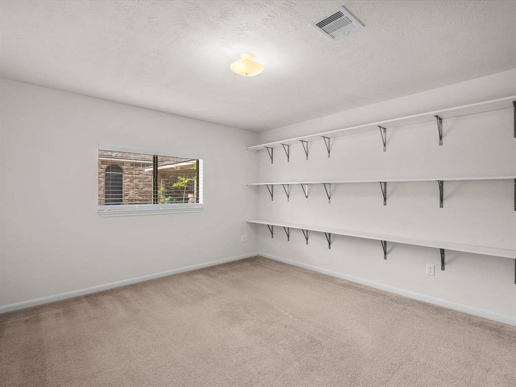 Bedroom #3 is approx 12' x 13', features a double closet, as well and a window to the side yard offers natural sunlight with more privacy and more furniture placement options!  Shelving is attached and removable to use for craft room, home office or study or display your proudest accomplishments here!