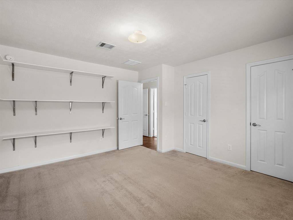 Bedroom #3 with view toward hall and of the double closet this spacious room enjoys