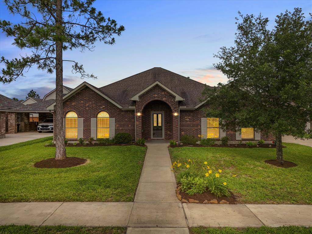 The invitation of your private sanctuary begins with the front elevation, warm and inviting with mature trees and a colorful flowerbed, with lawn sprinklers and drip lines to flowerbeds to ensure maximum enjoyment and less time watering. Low base taxes in Manvel ETJ and low HOA fees are another reason this home checks all the boxes!!