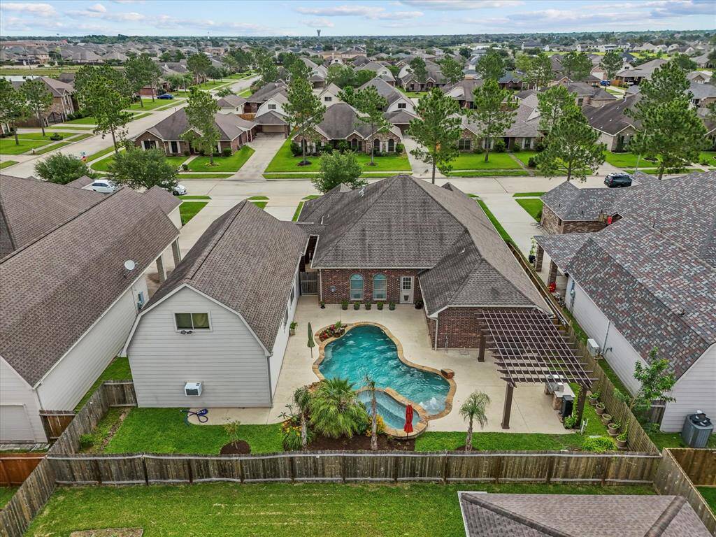 Aerial view of your backyard! Expanded patios and pool cool deck ensure maximum space to entertain and enjoy! No neighbor windows nearby enhance your enjoyment of your private backyard paradise!