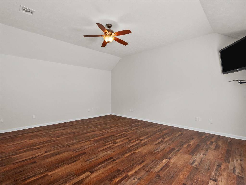 Primary bedroom is approx 15' x 19' and enjoys a gorgeous view of the pool through the double windows.  High ceilings enhance the already spacious room.