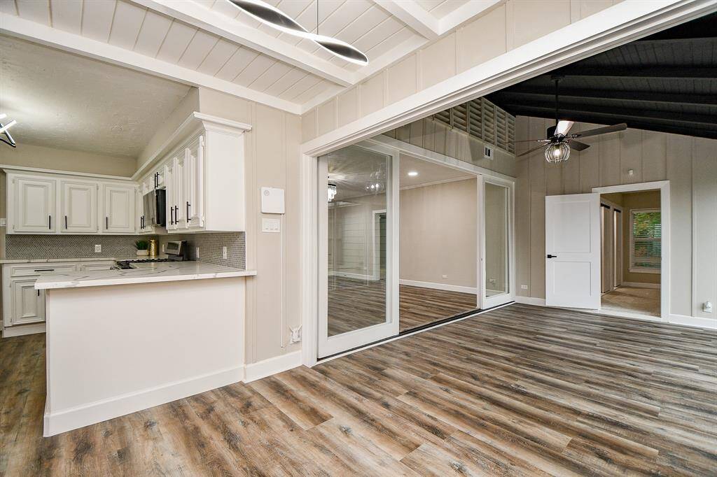 Open-concept living area with ample natural light from the breakfast bar. The layout offers seamless flow between primary and secondary bedroom spaces.