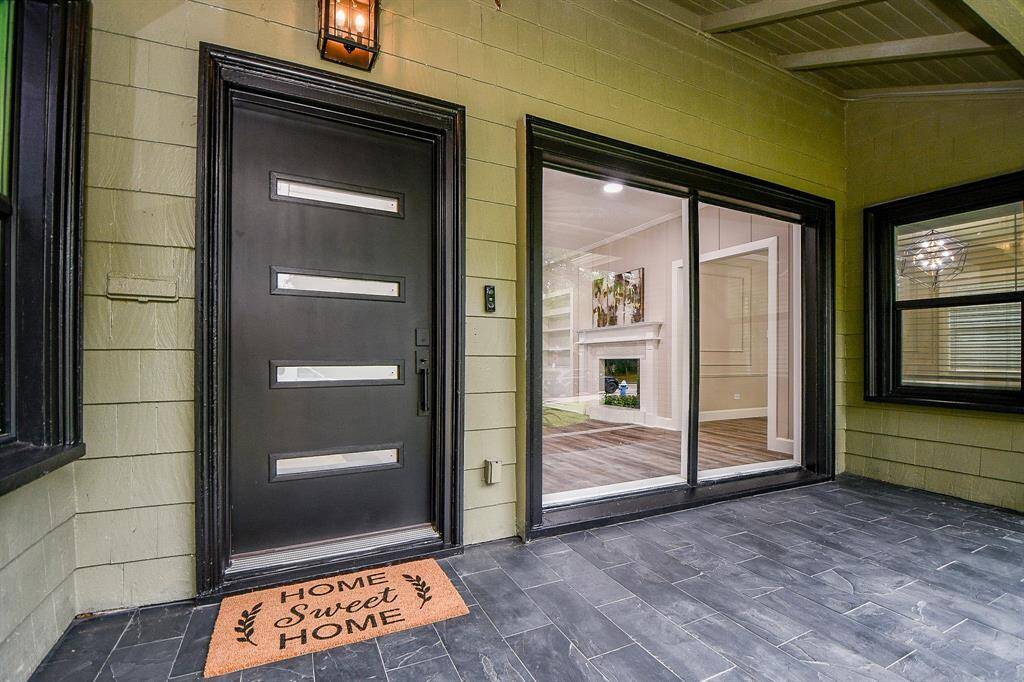 Home Sweet Home"  turn the key to this modern black door featuring horizontal glass panels.