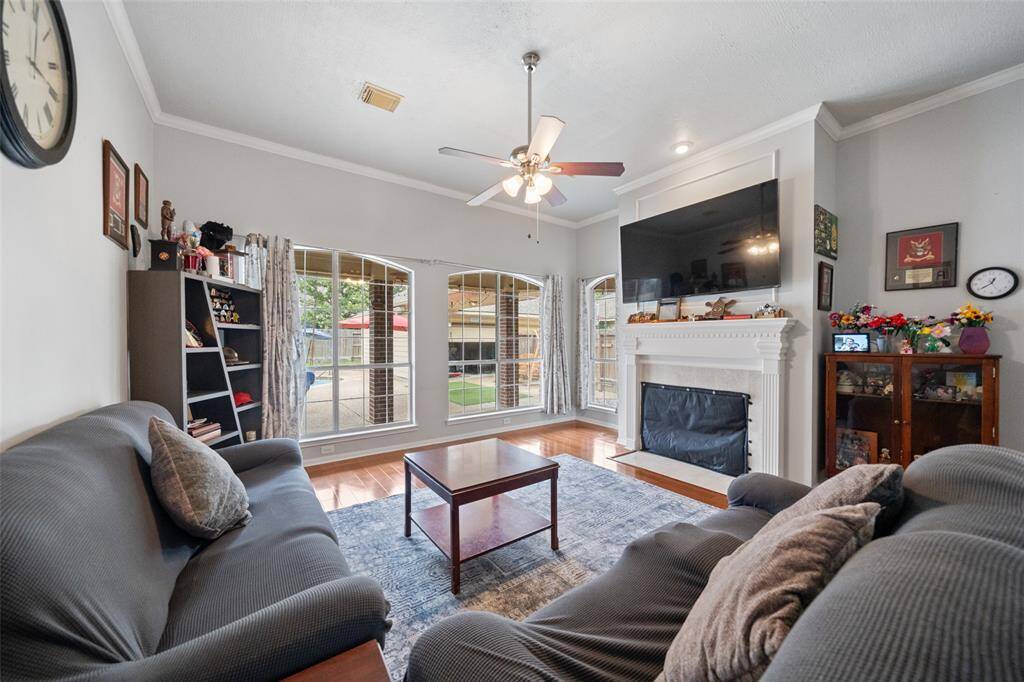 living room with windows overlooking the pool