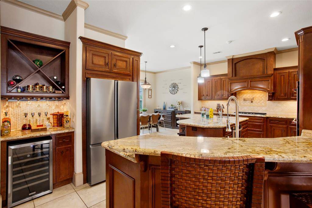 Dry bar off the kitchen with wine chiller, seller is also leaving the refrigerator purchased Aug 2024.