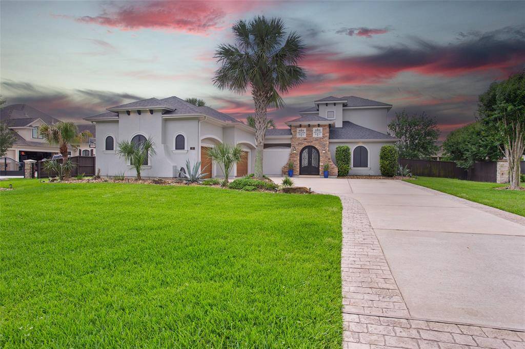 Beautiful stone and stucco finishes, wood look garage doors. Nicely landscaped both front and back.
