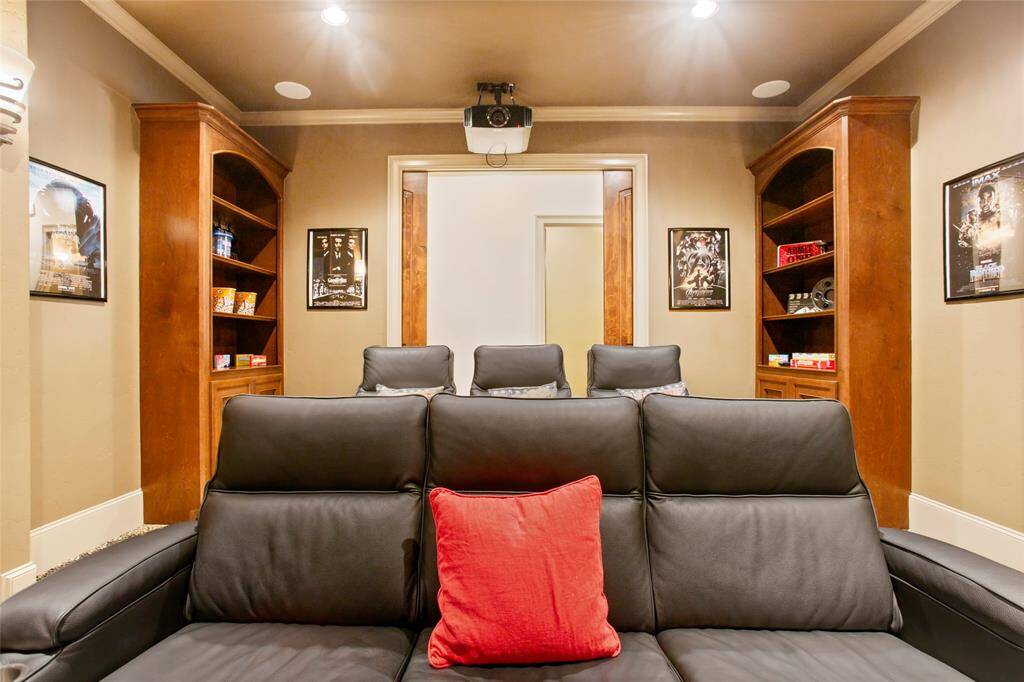 2 tier stepped media room with built ins plus double pocket doors for privacy.