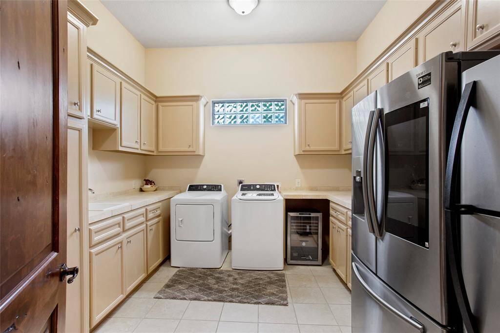 Walk in laundry with tons of storage, plus room for 3 full refrigerators (one not pictured)