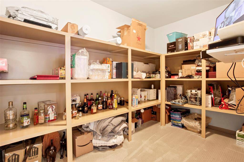 HUGE Air conditioned storage room upstairs measures 13'9x9'3 with full door leading to walk in attic which measures 19x13'8 with access to new (2024) upstairs Lennox AC units plus 2 Rinnai Tankless Water Heaters.
