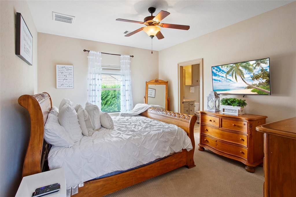 2nd primary bedroom upstairs with full private bathroom and walk in closet.