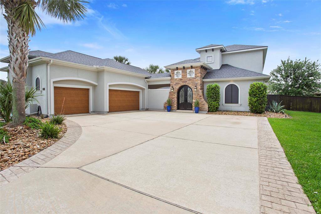 3 Car garage with gunite epoxy coated floors, built in custom storage cabinets, added MyIQ SMART garage door controlled by an APP. Dont miss the full staircase to unfinished room upstairs, this home has AMAZING storage!