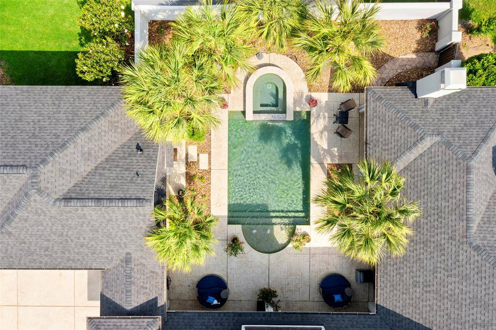 Atrium style floorplan with FABULOUS entertaining area between garage and main home.