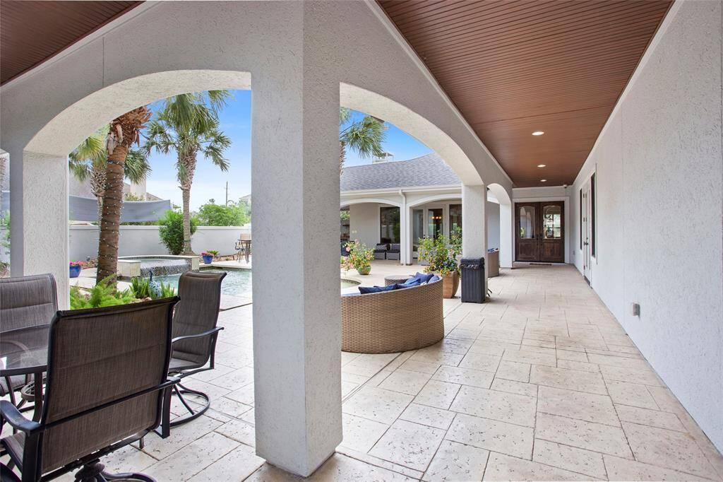 Pool area is finished with beautiful stamped concrete.