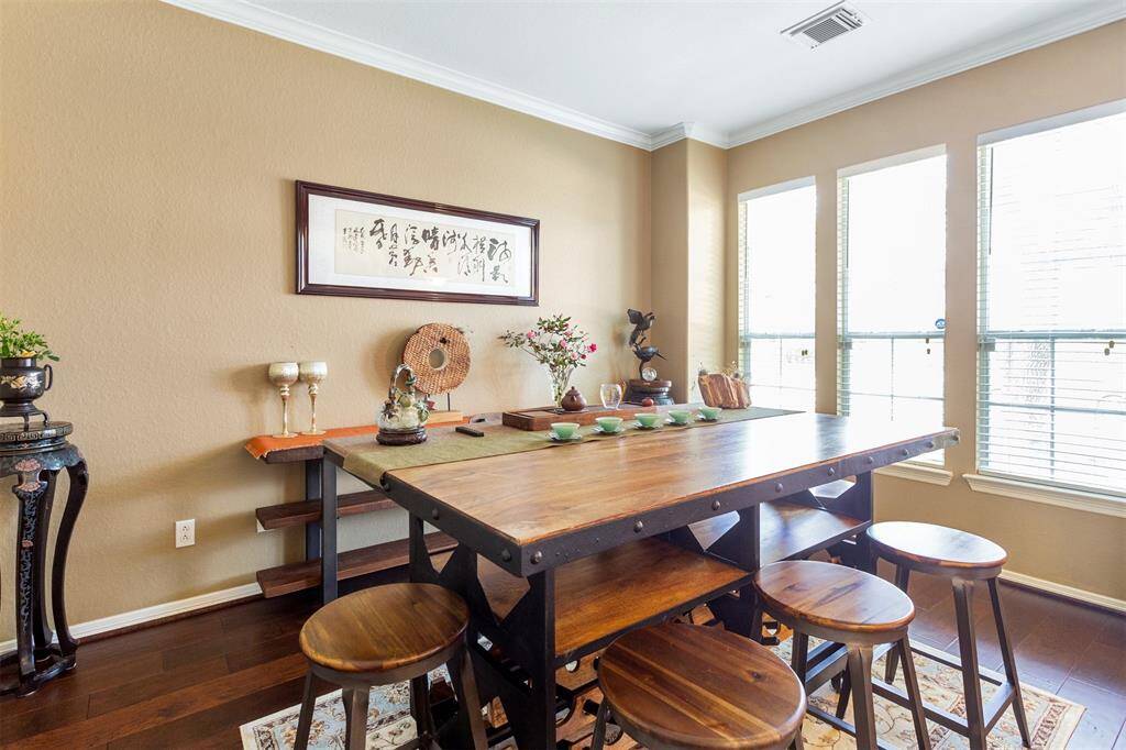 Bright tea room with abundant natural light and stunning front yard views.