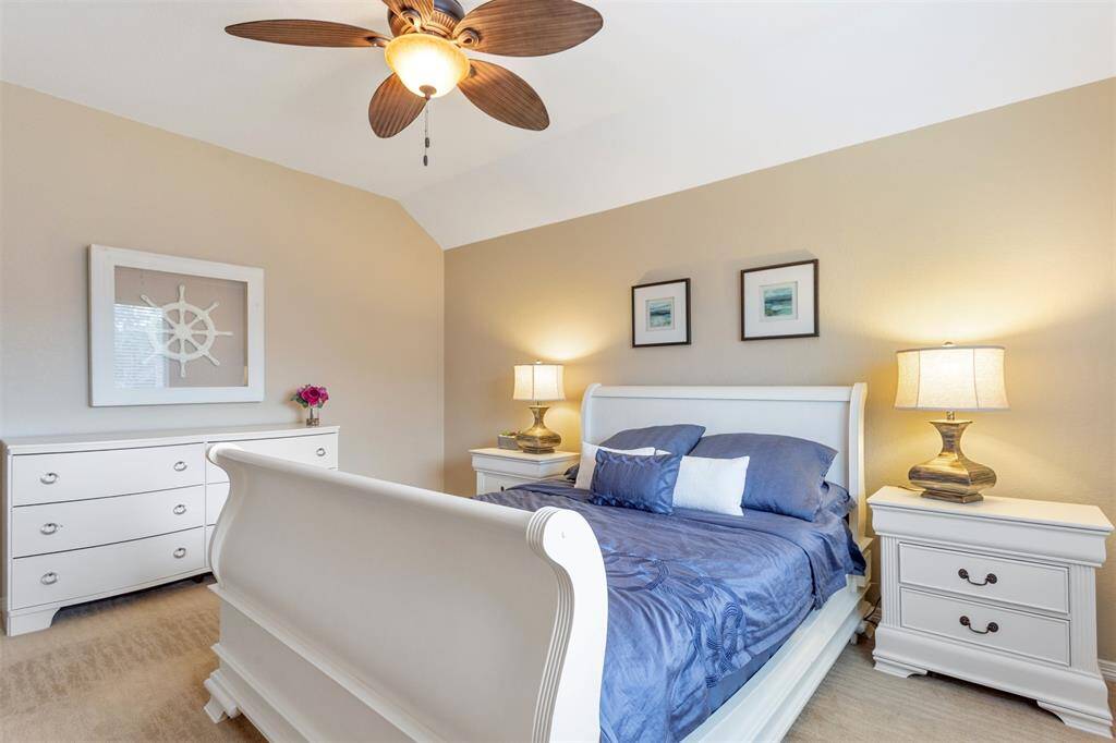 Spacious second-floor bedroom with ample natural light.