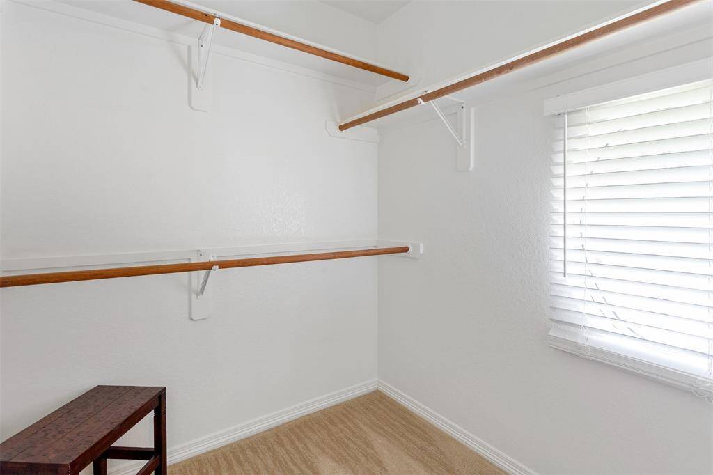 Spacious second-floor closet with abundant storage.