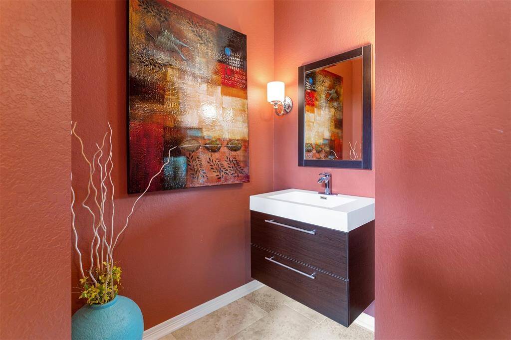 Elegant designer powder room perfect for guests.